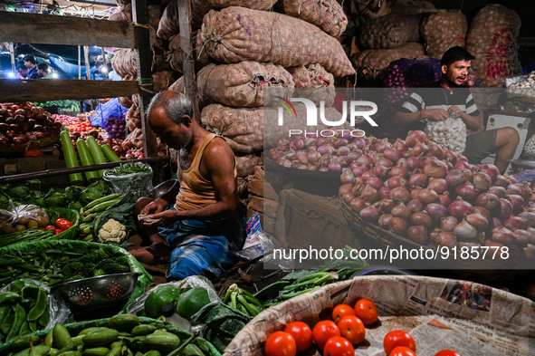 Vegetable sellers sell vegetables at a marketplace in Kolkata, on November 12, 2022. India's retail inflation, measured by the Consumer Pric...