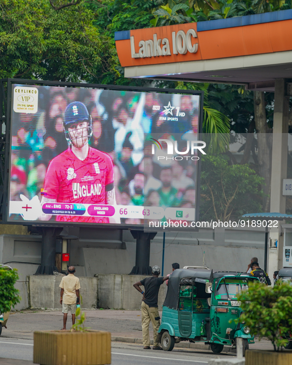 Sri Lankan cricket fans watching the T20 final between Pakistan and England through a large screen at a fuel station in Colombo, Sri Lanka o...