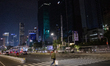 Man walk at pelican crossing in Jakarta on 13 November 2022. Indonesia's economy expanded...