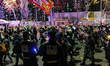 People march towards the presidential office during the 15th candlelight vigil around Seou...