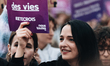 A demonstrator holds a purple sign with the slogan "Believing victims saves lives" during...