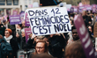 A demonstrator holds a sign with the slogan "In 12 feminicides it's Christmas" during a de...