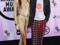 Joan Smalls and Brent Faiyaz arrive at the 2022 American Music Awards (50th Annual American Music Awards) held at Microsoft Theater at L.A....
