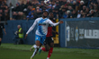 Hartlepool United's Theo Robinson is beaten to the ball by Barrow's Tyrell Warren during t...