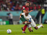 (18) RUBEN NEVES of Portugal team battel for possession on ball with (10) AYEW Andre of Ghana team during FIFA World Cup Qatar 2022  Group H...