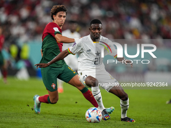 (11) JOAO FELIX of Portugal team battel on ball with (21) ABDUL SAMED Salis of Ghana team during FIFA World Cup Qatar 2022  Group H football...