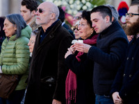 (Fom L) The parents of Valeria Solesin, Alberto and Luciana, her brother Dario and companion Andrea Ravagnani stand in front of the coffin o...
