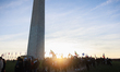 People march around the Washington Monument in Washington, D.C. on November 26, 2022 in me...