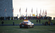 A police officer in a U.S. Park Police vehicle watches from the National Mall as people ma...