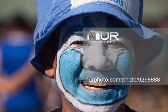 A fan of the Argentine soccer team attends a Fan Fest to watch the match between Argentina and Mexico at the World Cup, hosted by Qatar, in...