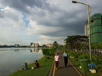 People relax on the banks of Inya Lake in Yangon, Myanmar, on November 29, 2022. (