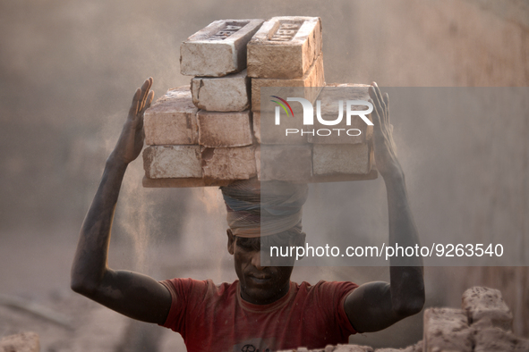 Seasonal Migrant workers during work at a brick-making field in Dhaka, Bangladesh on November 30, 2022. 