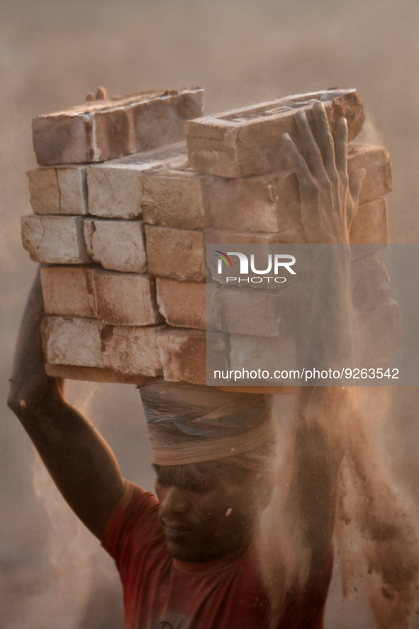 Seasonal Migrant workers during work at a brick-making field in Dhaka, Bangladesh on November 30, 2022. 