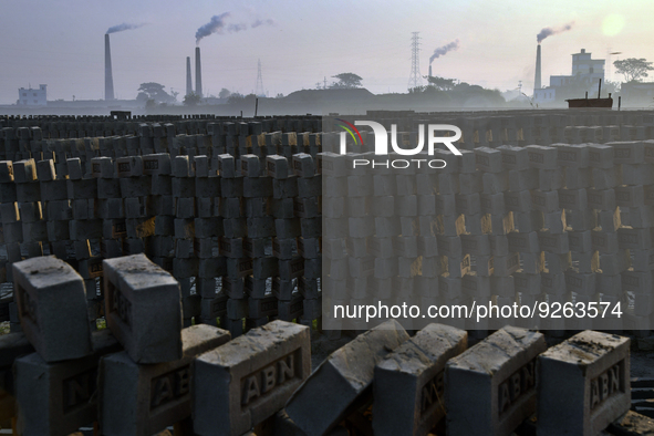Smoke come out from kiln at a brick field on the outskirt of Dhaka, Bangladesh on November 30, 2022. 