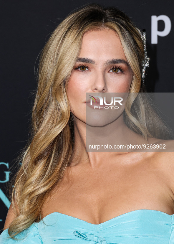 American actress Zoey Deutch wearing a Tiffany blue Carolina Herrera dress with Tiffany and Co. jewelry arrives at the Los Angeles Premiere...