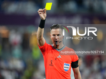 Referee MAKKELIE Danny give yellow card for (8) ACUNA Marcos of team Argentina during the FIFA World Cup Qatar 2022 Group C match between Po...