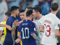 (10) MESSI Lionel of team Argentina and (9) LEWANDOWSKI Robert of team Poland after Argentina won the match at the FIFA World Cup Qatar 2022...