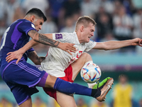 (13) ROMERO Cristian of team Argentina battle for ball with (16) FSWIDERSKI Karol of team Poland during the FIFA World Cup Qatar 2022 Group...