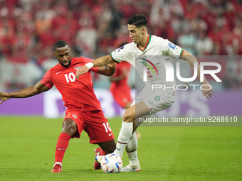 Nayef Aguerd centre-back of Morocco and West Ham United and Junior Hoilett Left Winger of Canada and Reading FC compete for the ball during...