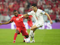 Nayef Aguerd centre-back of Morocco and West Ham United and Junior Hoilett Left Winger of Canada and Reading FC compete for the ball during...