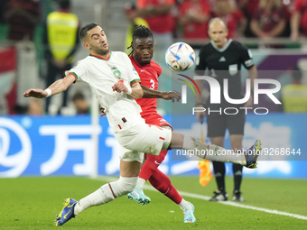 Sam Adekugbe Left-Back of Canada and Hatayspor and Hakim Ziyech attacking midfield of Morocco and Chelsea FC compete for the ball during the...