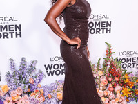 American actress Aja Naomi King arrives at the L'Oreal Paris' Women Of Worth Celebration 2022 held at The Ebell of Los Angeles on December 1...