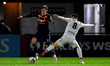 Ben Tollitt of Oldham Athletic in action with George Broadbent of Boreham Wood during the...
