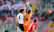 Alessandro Guarnone (C), goalkeeper of Valletta collects the ball despite the close cha...