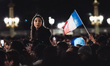 France's football team fans gather on the Place de la Concorde to welcome the players on t...
