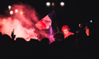 France's football team fans gather on the Place de la Concorde with French flags, smoke an...