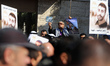 Demonstrators carry a portrait of Palestinian prisoner Nasser Abu Hamid, a cancer patient...
