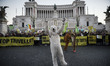 Demonstrators march during a rally calling for action on climate change on November 29, 20...