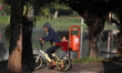 Palestinian children ride a bicycle in a public park in Gaza City, on December 25, 2022. 