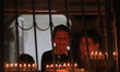 Ultra-Orthodox Jewish men light candles on the seventh night of Hanukkah in the Jewish Qua...