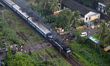 Thick black smoke bellows from a coal powered passenger train in the city of Thiruvanantha...