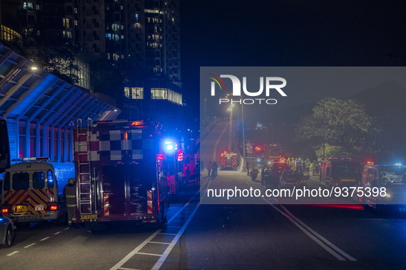 Emergency response vehicles near the site of a rolled over double decker bus on January 1, 2023 in Hong Kong, China. Police say 13 passenger...