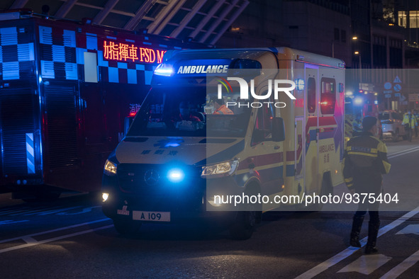 An ambulance near the site of a rolled over double decker bus on January 1, 2023 in Hong Kong, China. Police say 13 passengers were injured...