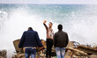 A young man taking image for himself on Gaza beach in rainy skies, on December 1, 2015. 