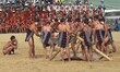 Naga tribesman from Yimchunger tribe performs a traditional Millet Harvest play on the thi...