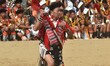 A Naga tribesman from Regma tribe performs a traditional Millet Harvest play on the third...