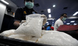 JAKARTA, INDONESIA, DEC-04: Courier meth Tommy Lim (35) secured by The Board National Narc...