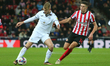 Swansea City's Harry Darling is closed down by Sunderland's Ross Stewart during the Sky Be...