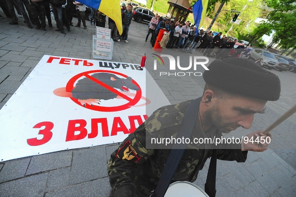 A large rat banner "reads, "get the rats out" displayed in front of the ministry office. Euromaiden revolutionaires and their supporters pro...