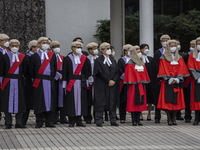 Hong Kong judges in wigs and robes watching a Ceremonial Guard mounted by the Hong Kong Police Force during the Ceremonial Opening of Legal...