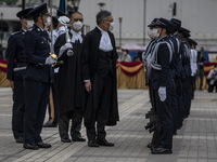 Hong Kong Chief Justice, Andrew Cheung Kui-nung escorted by a police officer inspecting a Ceremonial Guard during the Ceremonial Opening of...