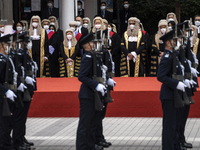 Hong Kong judges in wigs and robes watching a Ceremonial Guard mounted by the Hong Kong Police Force during the Ceremonial Opening of Legal...