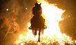A horseman rides through a bonfire during the traditional festival of ''Las Luminarias'' i...