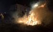 A horseman rides through a bonfire during the traditional festival of ''Las Luminarias'' i...