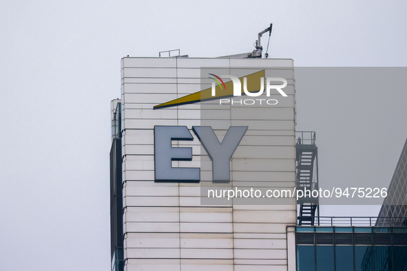 EY logo is seen on a building in Warsaw, Poland on January 19, 2023. 