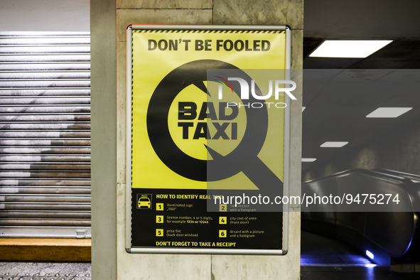 'Bad Taxi' warning poster is seen at the railway station in Warsaw, Poland on January 19, 2023. 